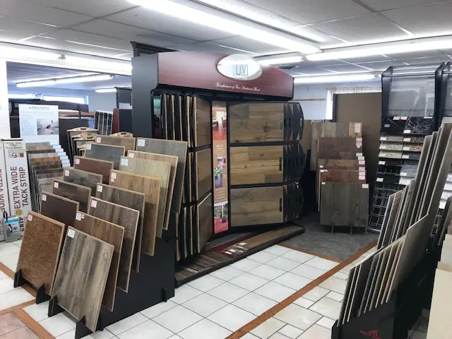 Showroom displays of wood-look hardwood, laminate and vinyl plank samples