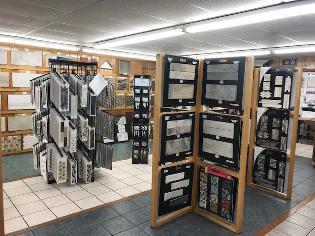 Hinged tile board displays standing in the showroom